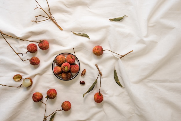 Lychees on white sheet