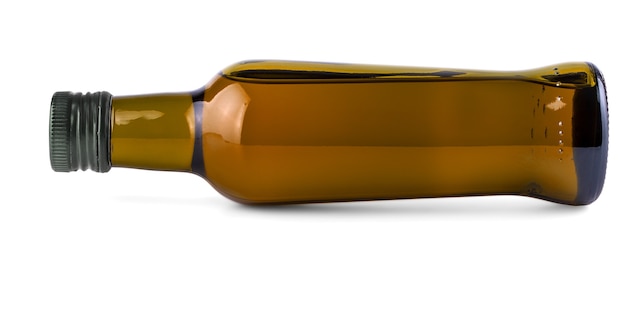 Photo the lying on the side green bottle with olive oil on white