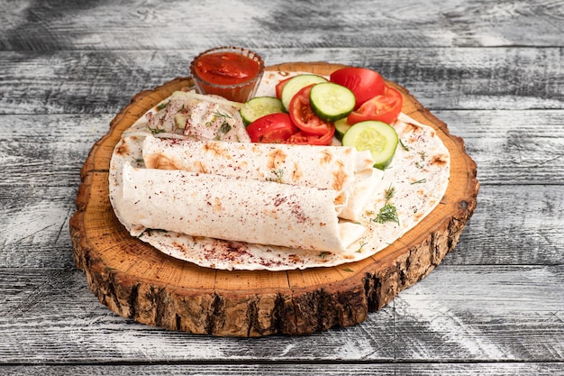 Lyulya kebab lyulya kebab in lavash on a wooden white background