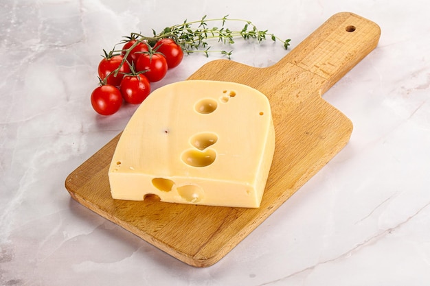 Maasdam cheese brick over board