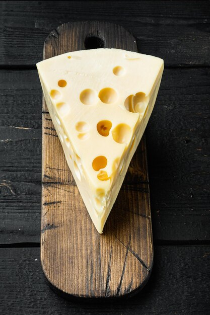 Maasdam cheese set, on black wooden background