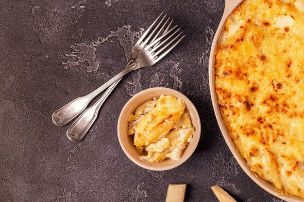 Mac and cheese, american style macaroni pasta in cheesy sauce