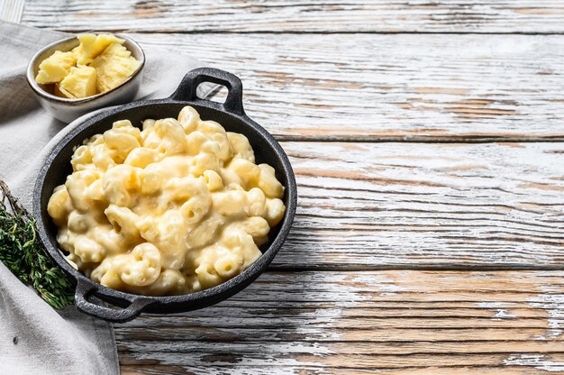 Mac and cheese, american style macaroni pasta in cheesy sauce.  