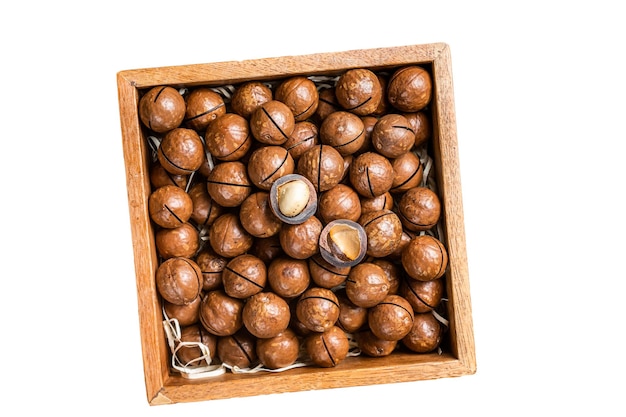 Macadamia natural nuts in a box Isolated on white background