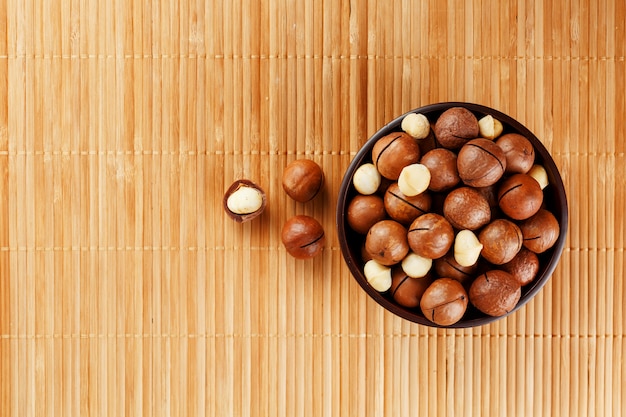 Macadamia nut on bamboo texture