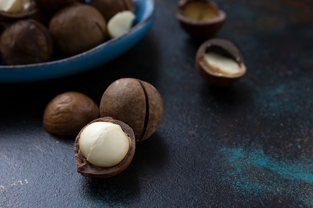 Macadamia nut on a black surface