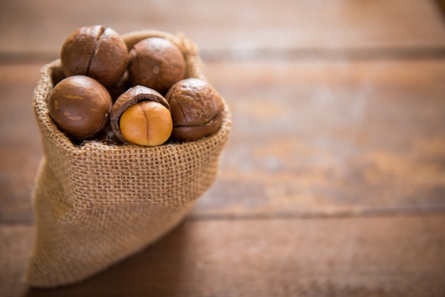 Macadamia nuts on wooden table