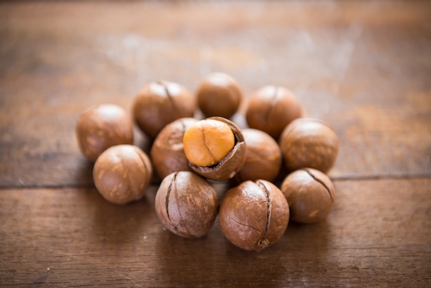 Macadamia nuts on wooden table