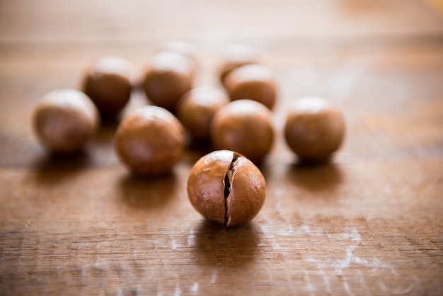 Macadamia nuts on wooden table