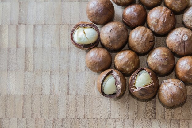 Macadamia on wood table.