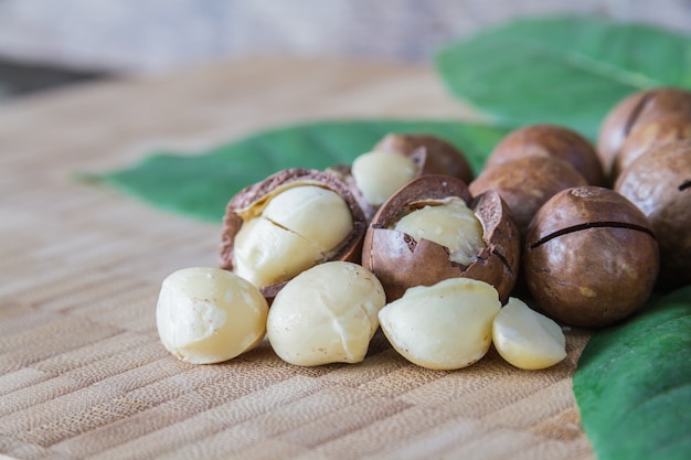 Macadamia on wood table.