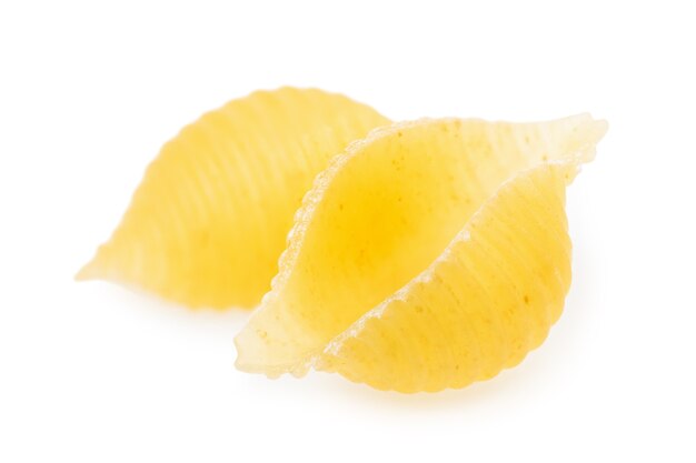 Macaroni in the form of a shell of solid wheat varieties isolated on a white background