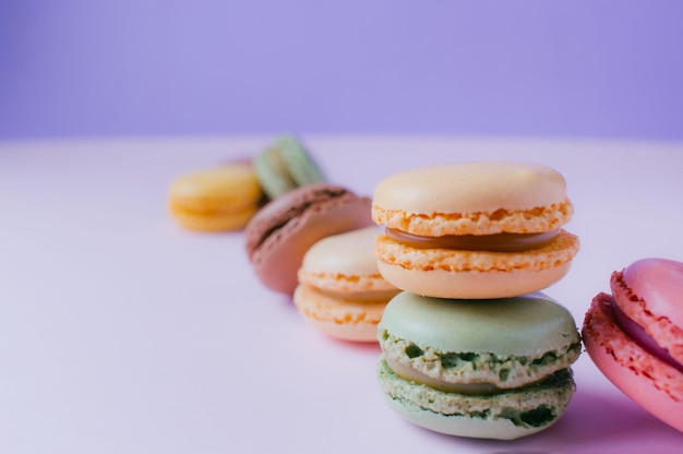 Macarons dessert on pastel tones background Copy space