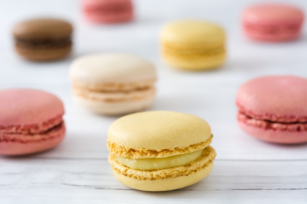 Macarons on a white wood table