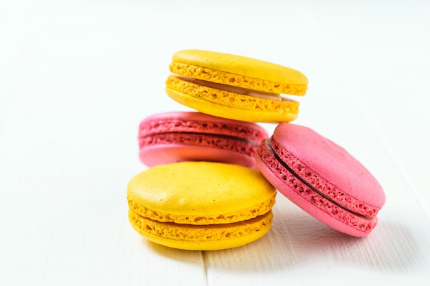 Macarons on a white wooden table