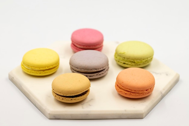 Macaroon dessert on white background Colorful macarons close up