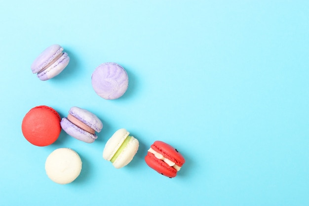 Macaroons on a colored background top view