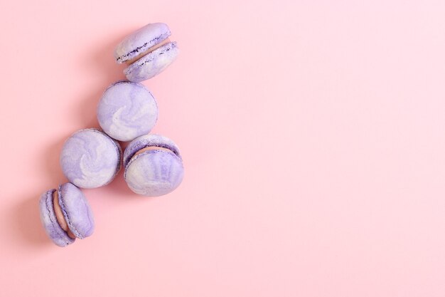 Macaroons on a colored background top view