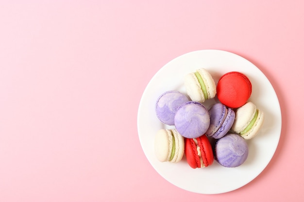 Macaroons on a colored background top view