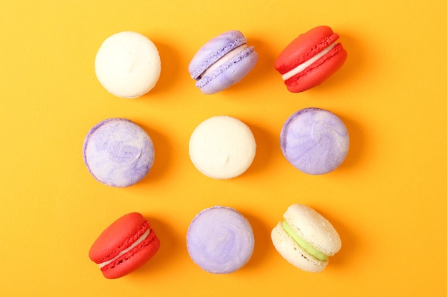 Macaroons on a colored background top view