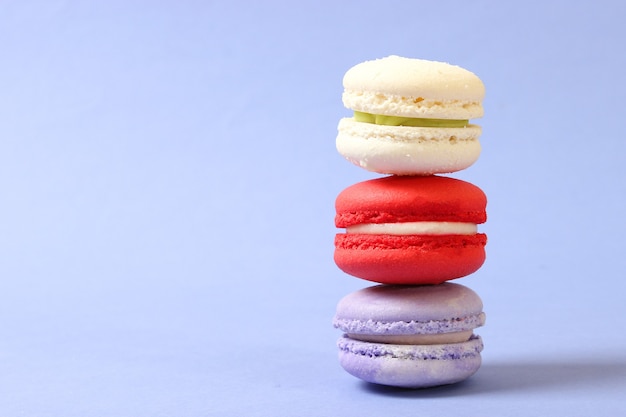 Macaroons on a colored background top view