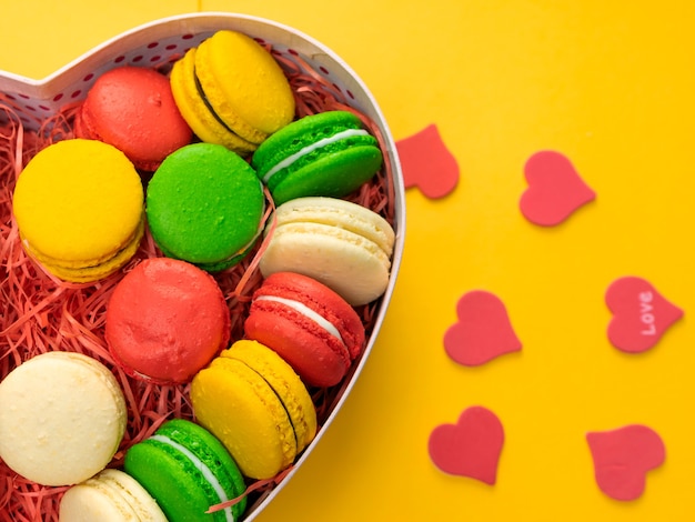 Photo macaroons in a gift box. heart-shaped box