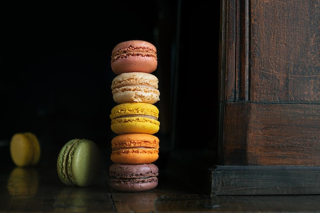 Macaroons on an old dark sideboard