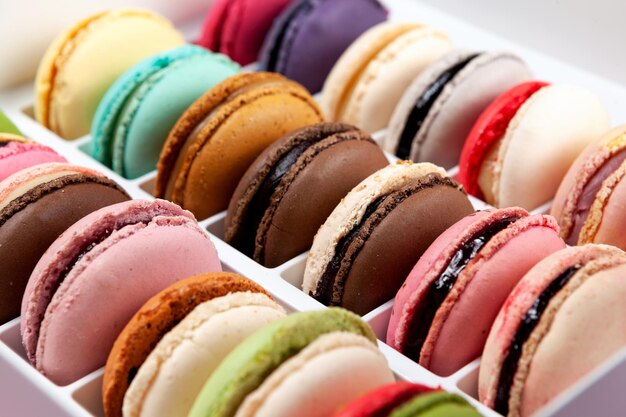 Macaroons with different fruit flavors closeup traditional\
french dessert design element selective focus