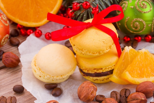 Macaroons with orange, christmas tree and decorations