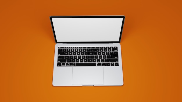 Macbook bovenaanzicht isoleren op oranje achtergrond premium foto