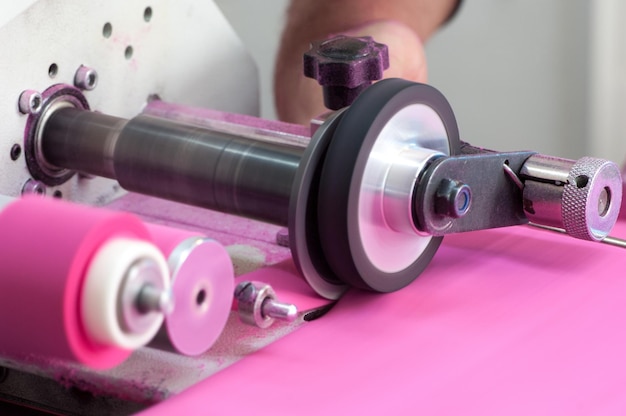 Machine for cutting and winding the cloth onto the spool closeup