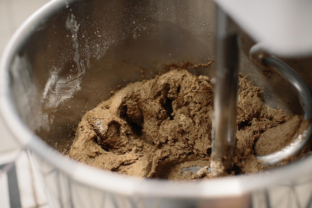 Machine for kneading bread in a bakery oven