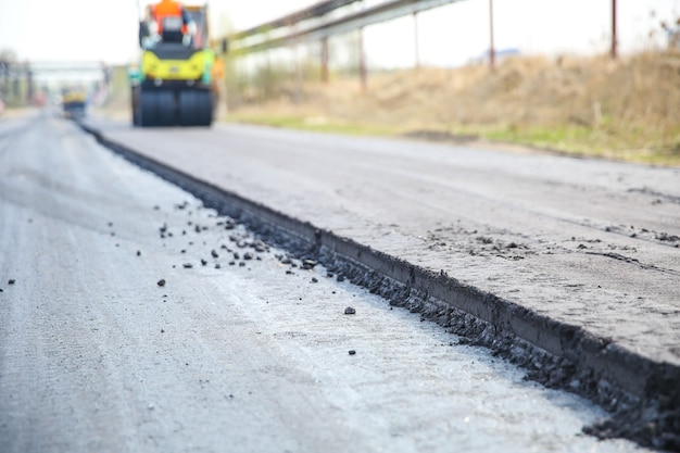 Machine paving the street