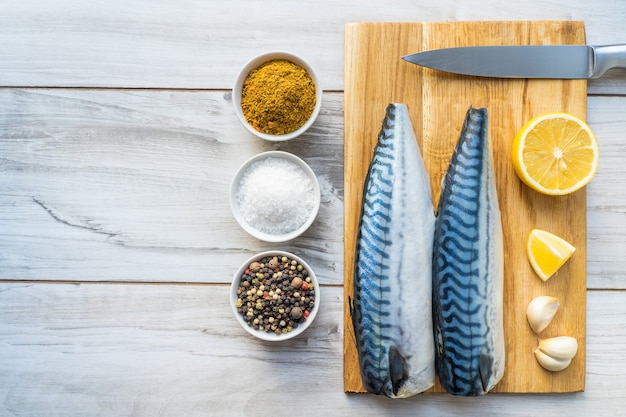 Mackerel cooking set. Frash raw fish with spices.