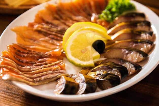 Mackerel and salmon on a plate with lemon