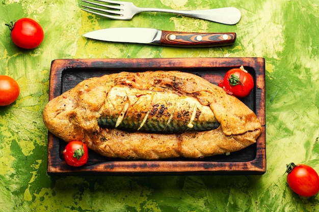 Mackerel or scomber baked in bread loaf