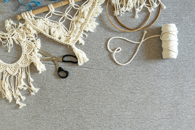 Macrame supplements on grey work table