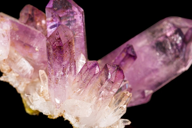 Macro of amethyst mineral stone on black background