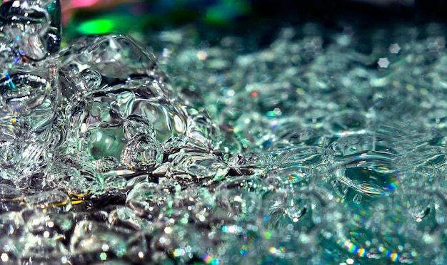 Photo macro background detail water liquid in motion moving and shining with air bubbles texture and detail