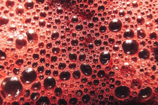 Foto macro-beeld van vers druivensap op een glas