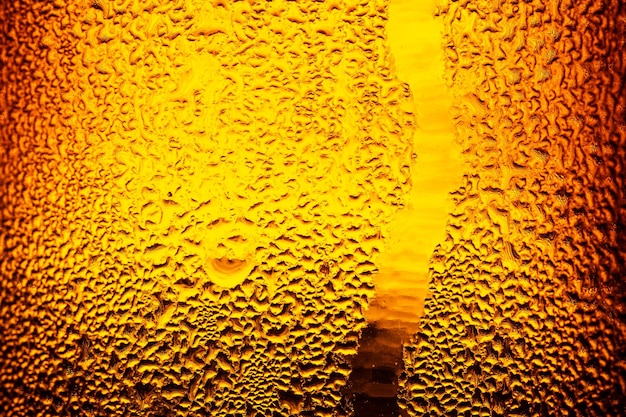 Macro bierfles achtergrond, waterdruppels textuur op de fles bier. abstracte achtergrond, water