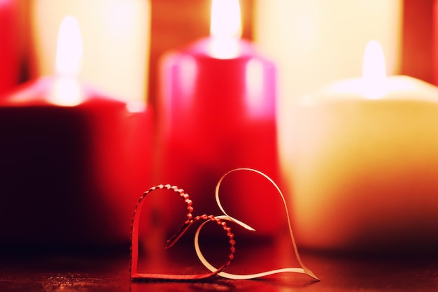 Macro candle light with heart shape