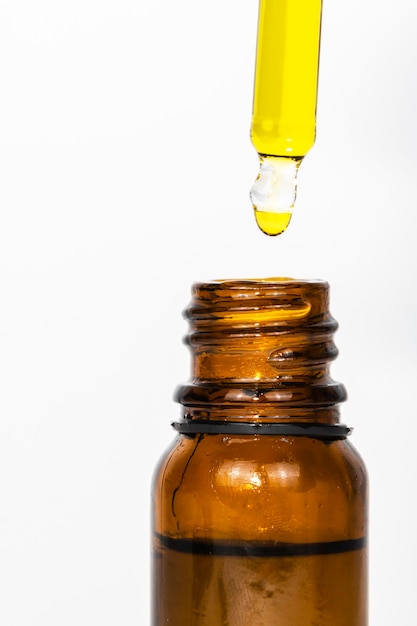 macro close-up of pipette with hemp oil.