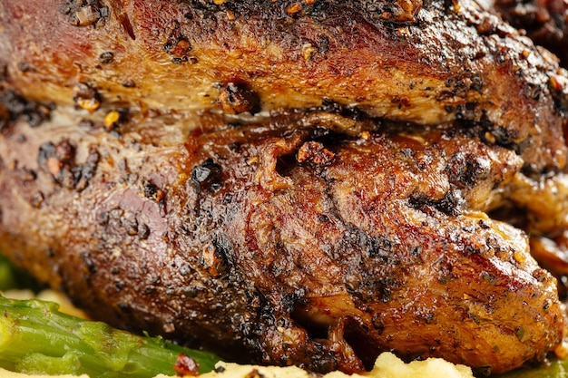 Macro closeup on grilled pepper beef steak texture