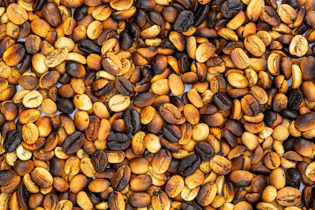 Photo macro coffee beans background,roasted coffee beans can be used as a background.