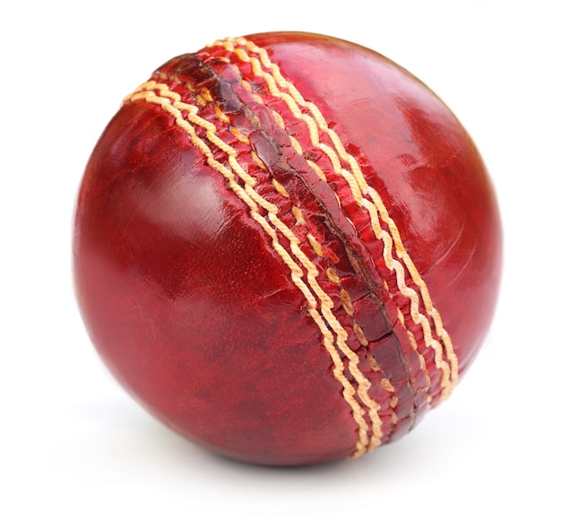 Macro of a cricket ball seam over white background