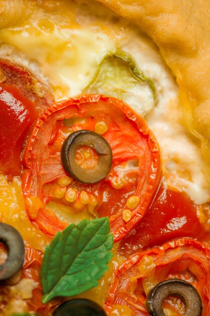 Macro food background. Delicious italian pizza close up. Pizza background macro shot.