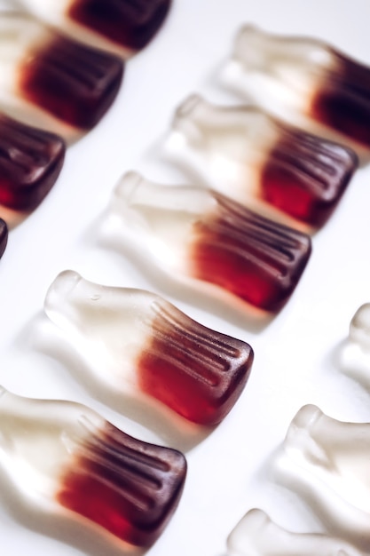 Macro jelly gummy candies in bottle shape with cola drink flavour
