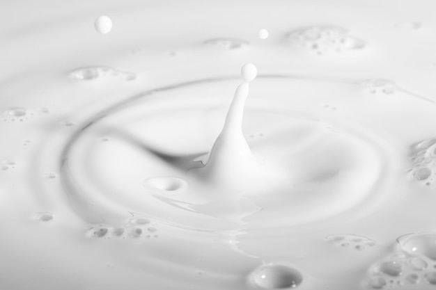 Macro milk drop,milk drops with ripples, Pouring milk