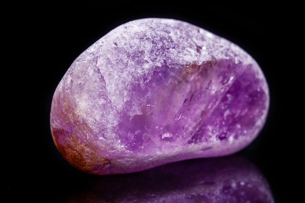 Macro mineral amethyst on a black background